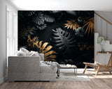 Monstera leaf mural in black and gold adding luxury feel to home office with natural light