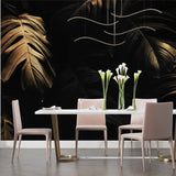 Metallic monstera design creating focal point in minimalist hallway
