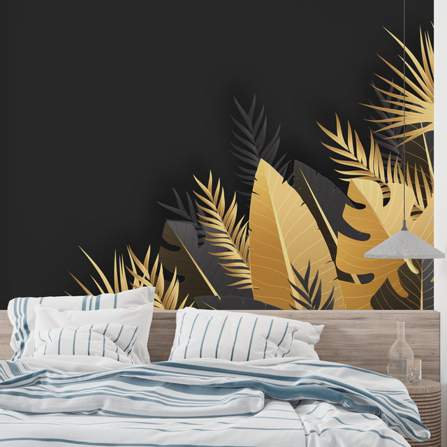 Black and gold tropical palm leaf wallpaper in modern living room with tall windows