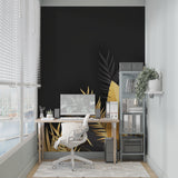 Master bedroom with elegant black and gold tropical leaf wall mural