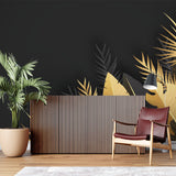 Bathroom accent wall with tropical palm leaf mural in black and gold