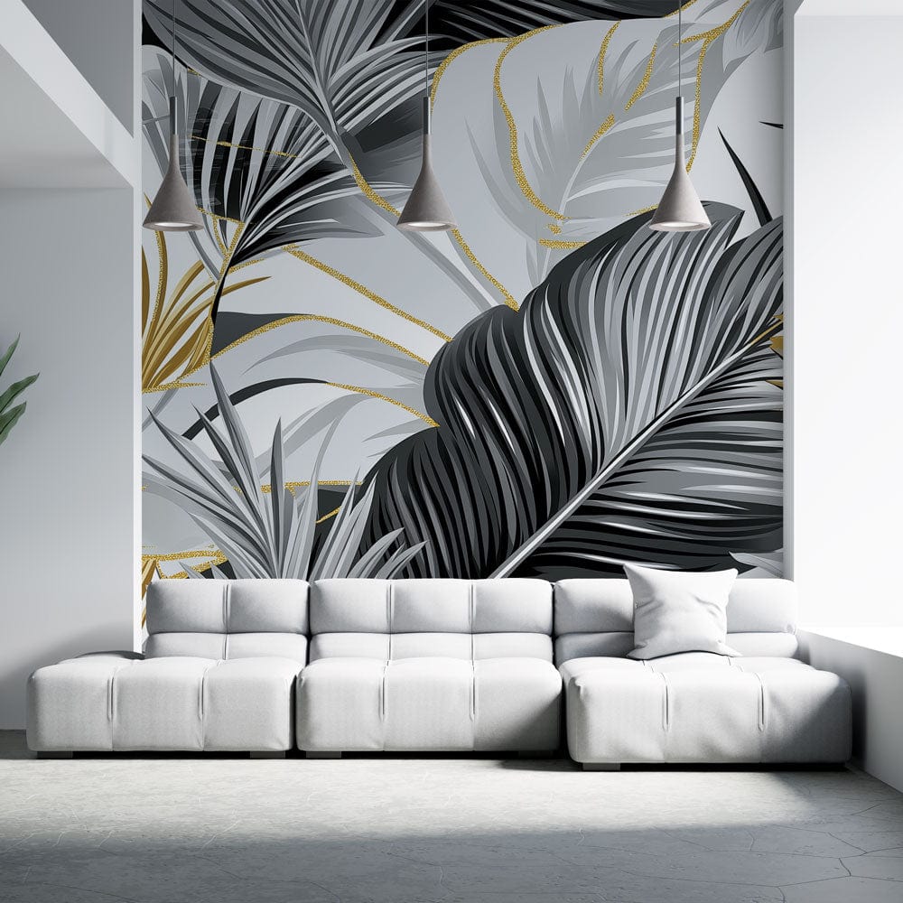 Tropical palm leaves wallpaper in black and gold creating drama in a modern living room with high ceilings