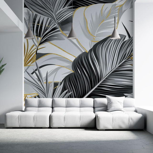 Tropical palm leaves wallpaper in black and gold creating drama in a modern living room with high ceilings