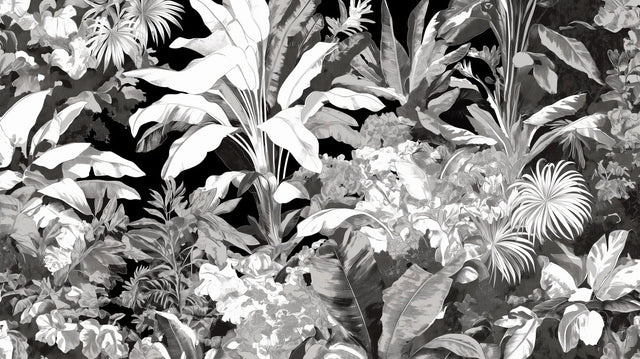 Black and white tropical botanical wallpaper creating drama in a modern living room with high ceilings and minimal furniture