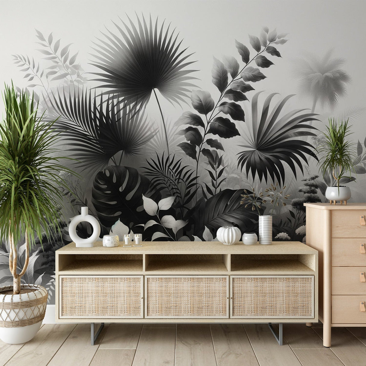 Black and white tropical botanical wallpaper creating drama in a modern living room with minimal furniture