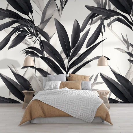 Black and white tropical leaf wallpaper creating a stunning focal point in a modern living room