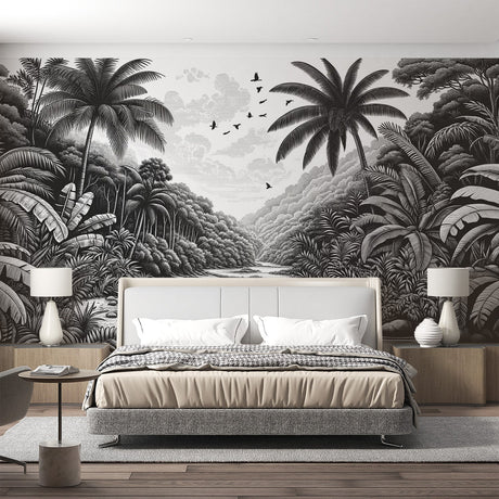 Black and white tropical jungle wallpaper creating depth in a modern living room with clean furniture and natural light