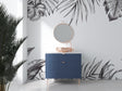 Black and white tropical leaf wallpaper creating a stunning accent wall in a modern living room