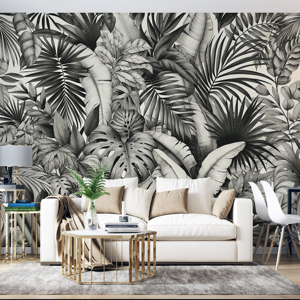 Black and white Monstera leaf wallpaper in a modern living room setting, creating a bold statement wall with dramatic contrast