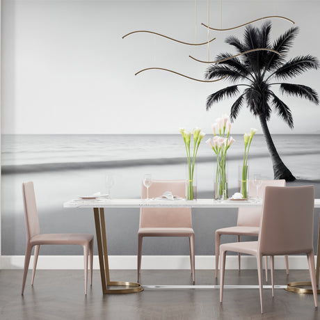 Black and white tropical beach wallpaper creating a calm atmosphere in a modern living room