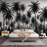 Black and white tropical palm wallpaper creating dramatic contrast in a modern living room with minimalist furniture