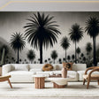 Black and white tropical palm grove mural wallpaper styled in modern living room with minimal furniture