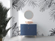 Black and white tropical palm leaf wallpaper in a bright modern living room setting with minimal furniture