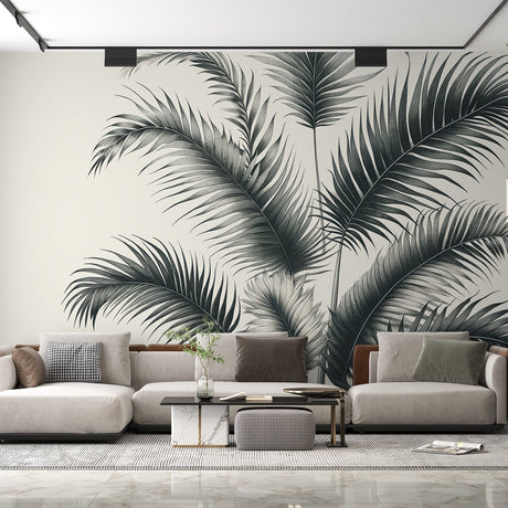 Black and white tropical palm leaf wallpaper creating a dramatic statement wall in a modern living room with minimal furniture