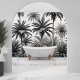 Tropical palm mural wallpaper enhancing dining room with dramatic black and white contrast