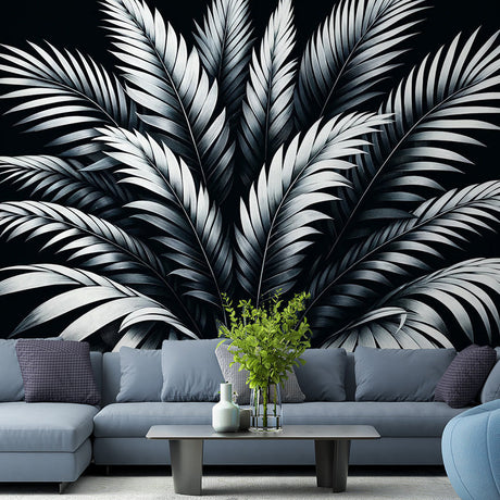 Black and white tropical palm leaf wallpaper creating dramatic impact in a modern living room with high ceilings