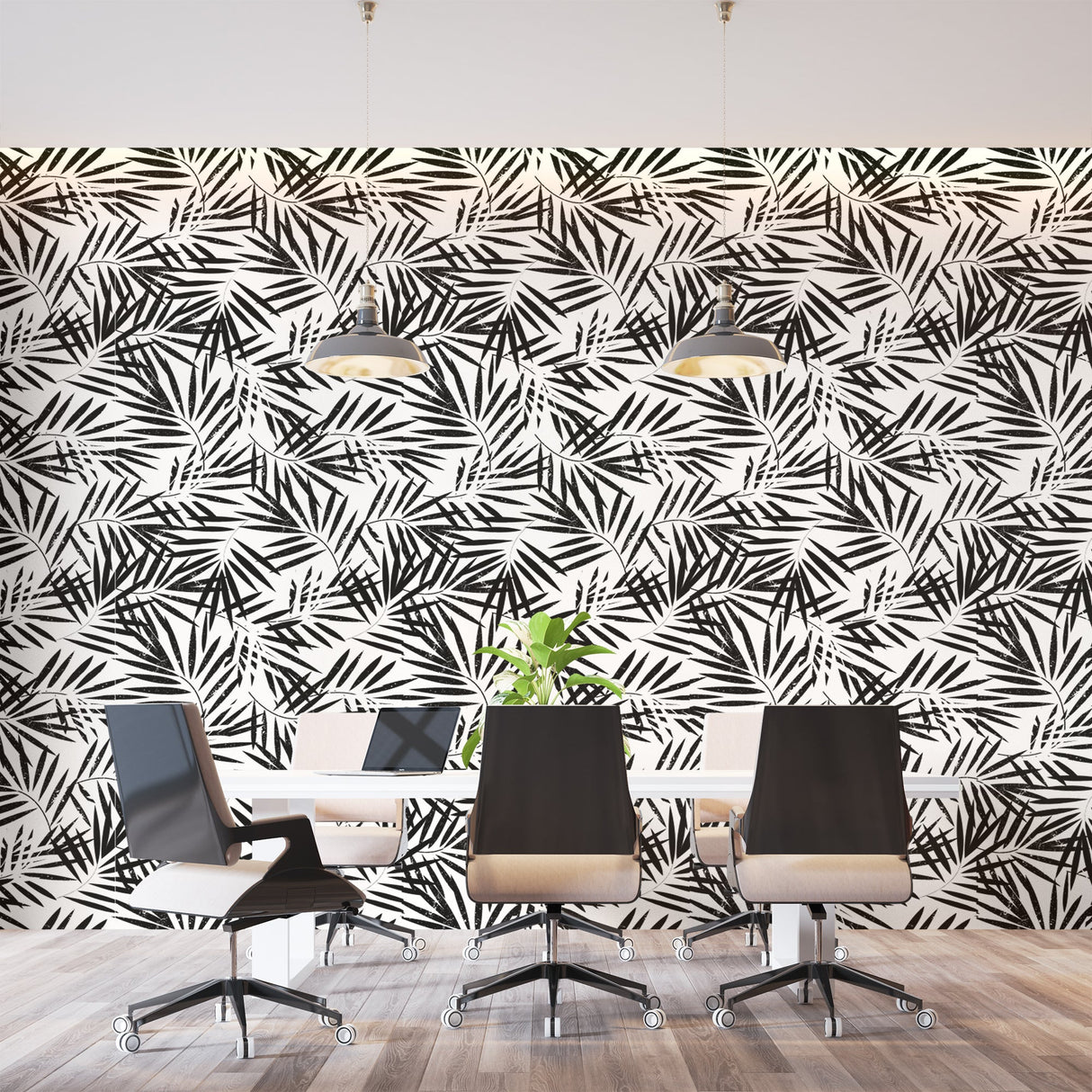 Black and white tropical palm leaf wallpaper creating a modern statement wall in a bright living room setting