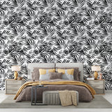 Monochrome palm pattern wallpaper bringing fresh style to a minimalist bedroom interior