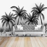 Monochrome palm tree mural creating drama in a contemporary dining room space