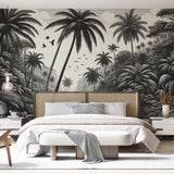 Black and white tropical paradise wallpaper creating a dramatic focal point in a modern living room with minimalist furniture