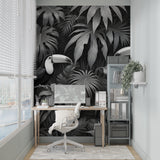 Sophisticated black and white jungle mural transforming a bedroom wall