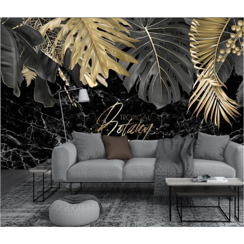 Tropical black and gold leaf wallpaper in modern living room showing dramatic marble effect and metallic accents