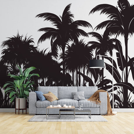 Tropical palm tree silhouette wallpaper creating drama in a modern living room with white sofa and minimal decor