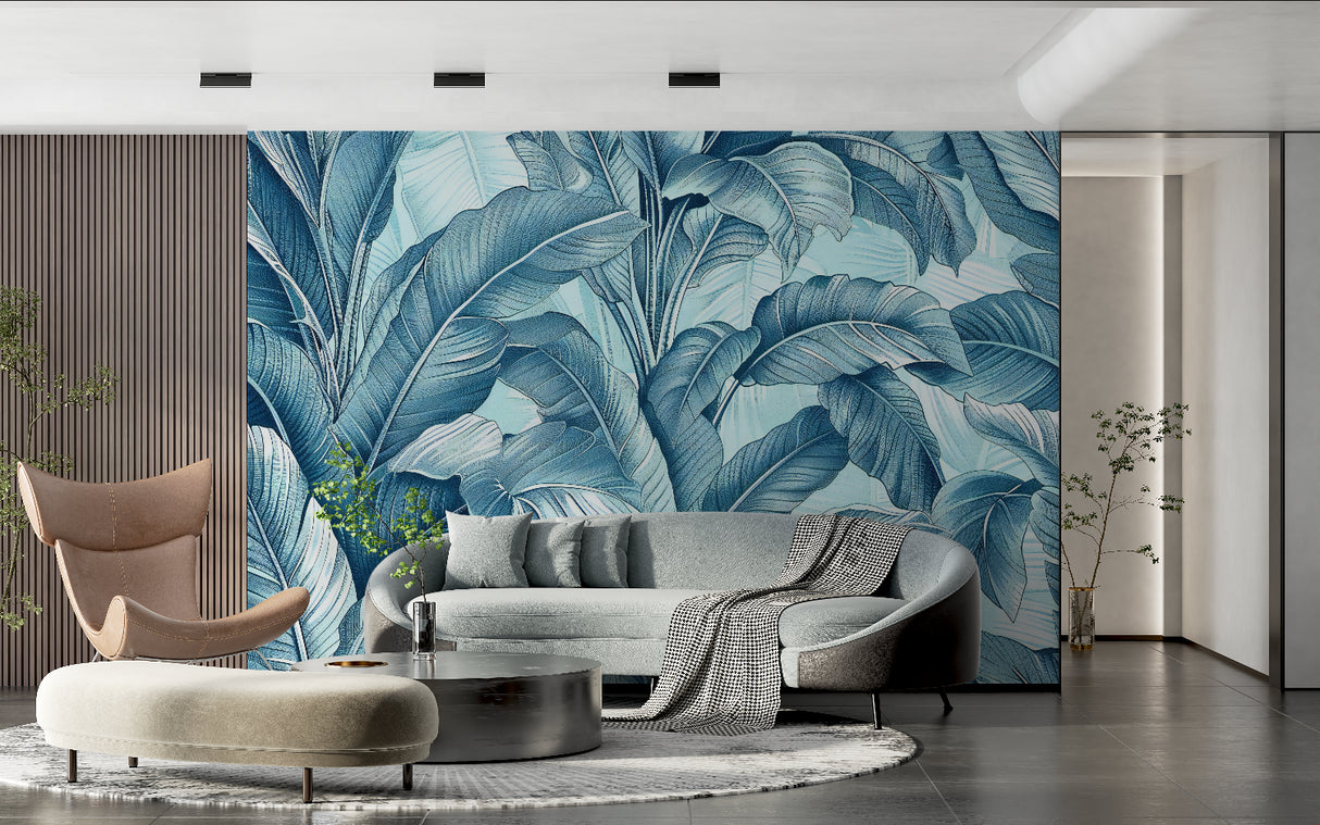 Tropical banana leaf wallpaper in blue tones creating a stunning accent wall in a modern living room