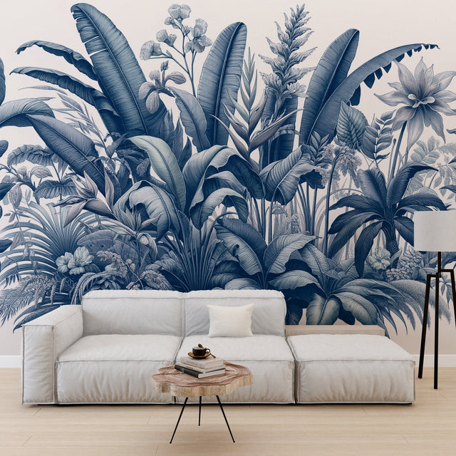 Blue tropical botanical wallpaper creating a serene atmosphere in a modern living room with white furniture