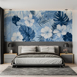 Blue Monstera wallpaper in modern living room with white sofa and natural light