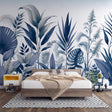 Blue Monstera leaf wallpaper creating a fresh tropical statement in a modern living room with white furniture