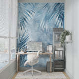 Blue Palm Leaves Mural Wallpaper in bright modern living room with white sofa and natural light