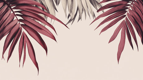 Burgundy palm leaf wallpaper mural creating a dramatic accent wall in a modern living room with natural light