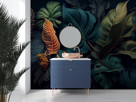 Tropical leaf wallpaper with gold accents creating drama in modern living room with grey sofa and natural light