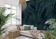 Tropical palm leaf wallpaper in modern living room creating a bold statement wall with deep green botanical pattern