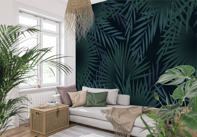 Tropical palm leaf wallpaper in modern living room creating a bold statement wall with deep green botanical pattern