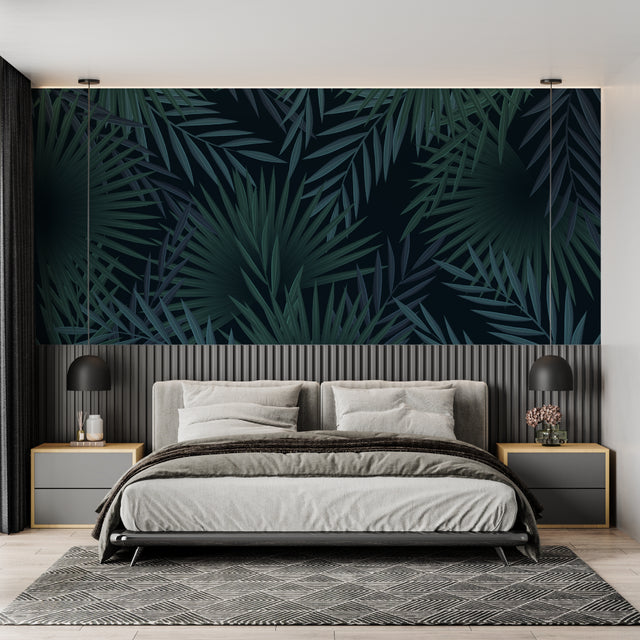 Tropical palm leaves wallpaper in modern living room with black sofa and natural light