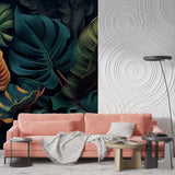Dark Monstera leaf wallpaper in modern living room with gray sofa and natural light