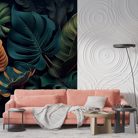 Dark Monstera leaf wallpaper in modern living room with gray sofa and natural light