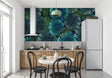 Tropical Monstera wallpaper in modern living room showing deep blue leaves against white furniture