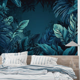 Deep teal leaf mural transforming a bedroom into a peaceful retreat