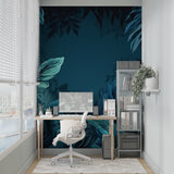 Tropical leaf wallpaper bringing life to a home office space with rich teal tones
