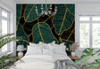 Tropical leaf wallpaper with gold accents in modern living room showing emerald green monstera pattern