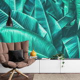 Banana leaf wall mural in bright dining area creating natural atmosphere