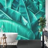 Green tropical wallpaper making statement in master bedroom with natural light