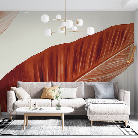 Tropical leaf wallpaper with orange banana leaves creating a bold statement in a modern living room with natural light