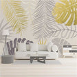 Tropical palm leaves wallpaper in gold and grey creating a luxurious atmosphere in a modern living room