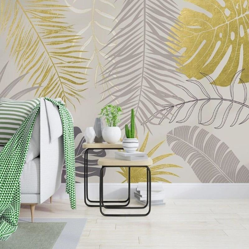Palm leaves wallpaper in metallic gold and grey tones making a statement in a dining room