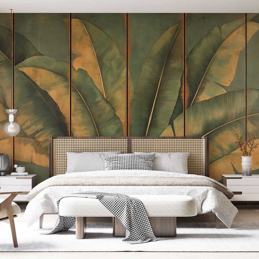 Tropical banana leaf wallpaper with golden accents creates a stunning backdrop in a modern living room with natural light