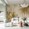 Tropical palm leaf wallpaper in gold tones creating a stunning accent wall in a modern living room